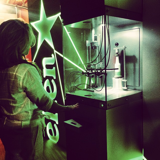 A woman creates her own Heineken bottle.